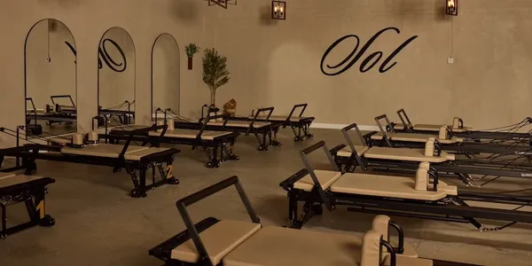 Sol Pilates studio with reformers and mirrors